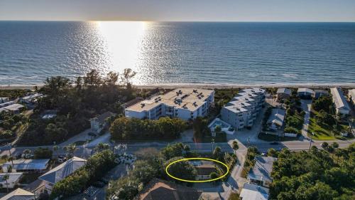 an aerial view of a house next to the ocean at Charming Manasota Key duplex with beach access- IB14 in Englewood