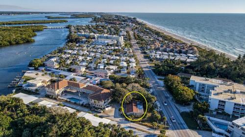 an aerial view of a resort with a yellow circle at Charming Manasota Key duplex with beach access- IB14 in Englewood