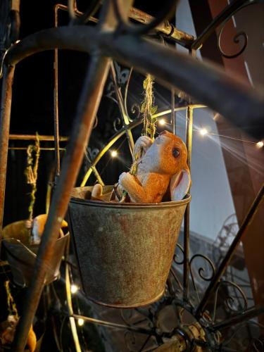 a bird ornament hanging from a hanging basket at UMANI Retreat in Buşteni