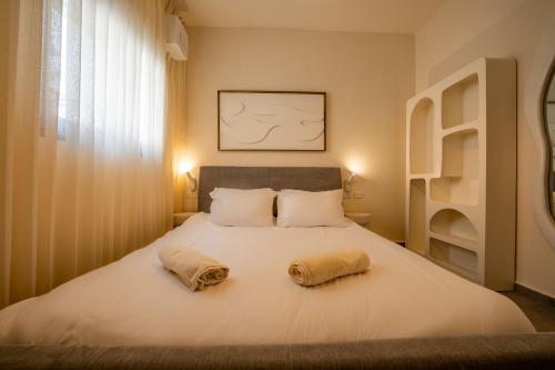 Letto o letti in una camera di Boutique Apartments - By Harim