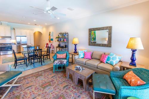 a living room with a couch and chairs at Journeys End 203 in Coffeyville