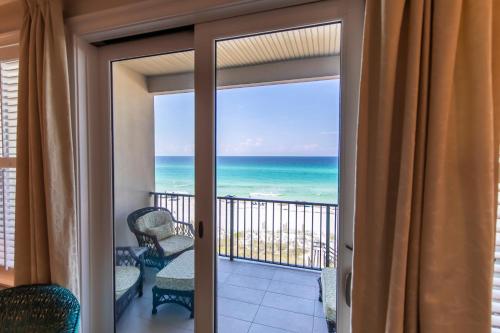 a balcony with a view of the ocean at Journeys End 203 in Coffeyville