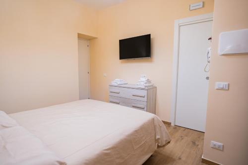 Ένα ή περισσότερα κρεβάτια σε δωμάτιο στο Tribunale Suite
