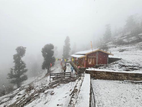 a train station in the snow on a mountain at Nanda Kot Home Stay in Bāgeshwar