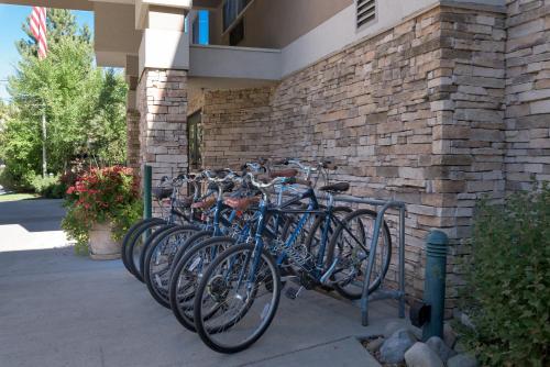 a row of bikes parked next to a brick wall at Wood River Inn & Suite in Hailey