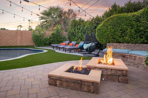 a fire pit in a yard with couches and a patio at Old Town Farm-to-Table Home - Gourmet Adventure with Pool in Scottsdale