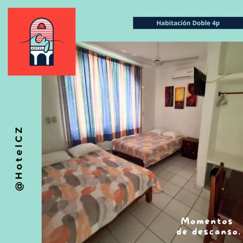 a hotel room with two beds and a red sign at Hotel CZ in Santa Cruz Huatulco