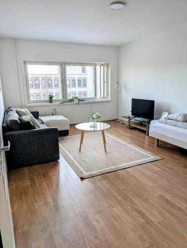 a living room with a couch and a coffee table at 20 - Nice apartment in Kemi City Centre, free parking! in Kemi