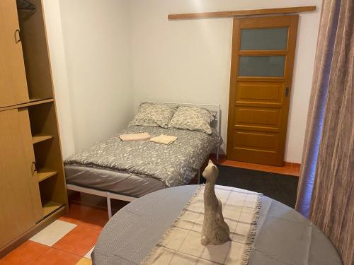 a small room with a bed and a table at Arkuszowa 58 Studio 15 in Warsaw