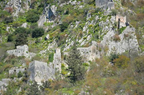 an old castle on the side of a mountain at Stylish apartment 22 in Kotor