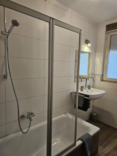a bathroom with a shower and a sink at Sea Sand in Friedrichshafen