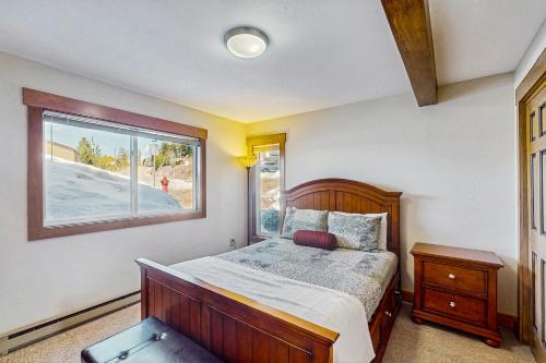 a bedroom with a bed and a window at Mountain Dreams Condo in Fraser