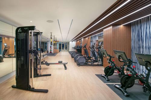 a gym with a row of treadmills and exercise bikes at The Royal Sonesta Washington DC Capitol Hill in Washington