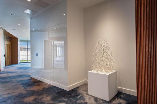 a art exhibit in a building with a sculpture at The Royal Sonesta Washington DC Capitol Hill in Washington