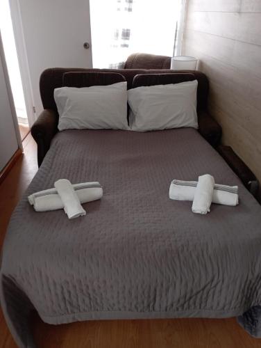 a large bed with two pillows on top of it at Vista Pico House in Madalena