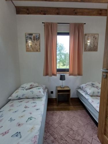 Postel nebo postele na pokoji v ubytování Widokówka Myczkowce 2