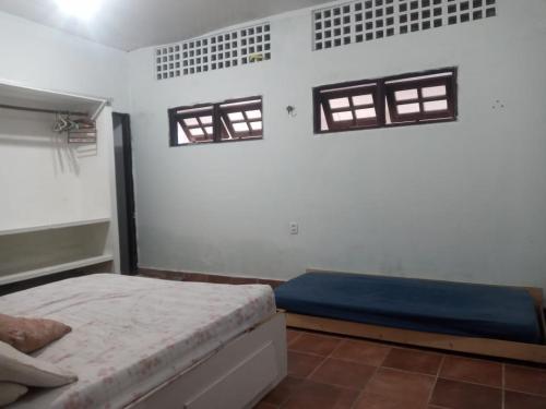 Cama ou camas em um quarto em Aconchego Suítes
