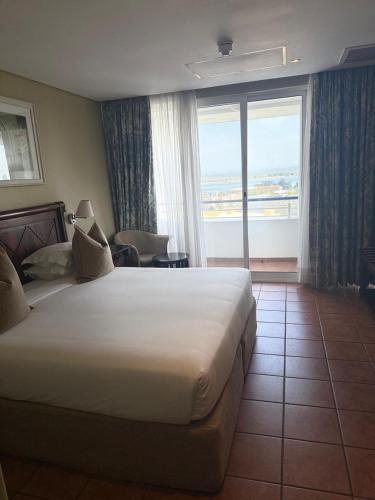 Postel nebo postele na pokoji v ubytování Hotel Cardoso