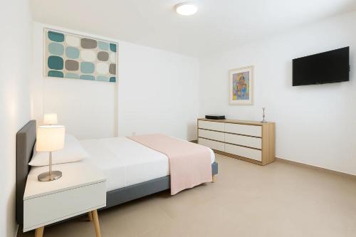 Cama o camas de una habitación en Gioia 13 Rooms & Apartments