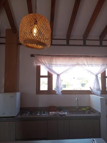 a kitchen with a sink and a window at Ensueño de Mariana y la Montaña in Sáchica