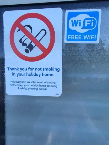 a sign on a window that says not smoking in your holiday home at Exclusive Gold 3 Bed Luxury Caravan in Port Seton