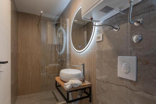 a bathroom with a sink and a shower at Holiday house Katica in Grubine