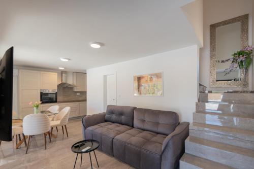 a living room with a couch and a table at Holiday house Katica in Grubine