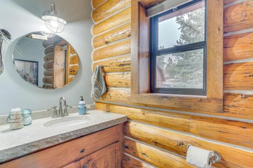 a bathroom with a sink and a window at 18 Mi to Royal Gorge Peaceful Mtn Cabin with Porch! in Cotopaxi