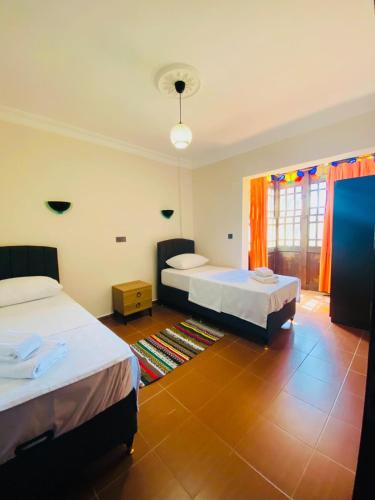 Ένα ή περισσότερα κρεβάτια σε δωμάτιο στο Lykia Way 2 bedroom apartment Oludeniz Pool