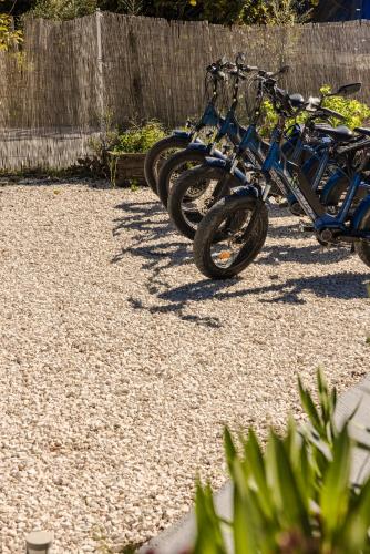 a row of bikes parked next to a fence at Sofi Hotel in Neokhórion
