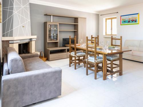 a living room with a table and a couch at Domus Albano laziale in Albano Laziale