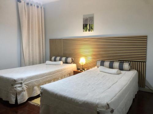 a hotel room with two beds and a window at Olivia's Place in Funchal