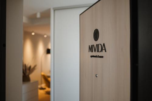 a door in a room with a sign on it at Apartment MIVIDA in Posušje