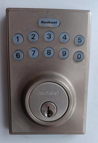 a close up of a remote control with numbers on it at La campagne en ville avec spa in Laval