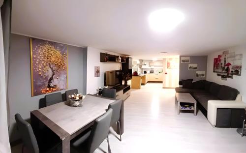 a living room with a table and a couch at La Casa di Anna in Zagarolo