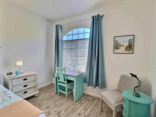 a bedroom with a bed and a desk and a chair at Pacific Plaza #608 - Oceano Getaway - 1BdrmUp-K-QSofa in Oceano