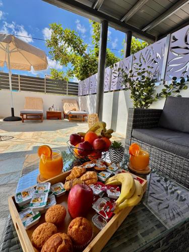 a tray of food on a table on a patio at La vie est belle Luxury Residence With Jacuzzi '2' in Pounda