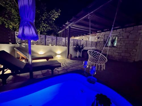 a night view of a swimming pool in a backyard at La vie est belle Luxury Residence With Jacuzzi '2' in Pounda