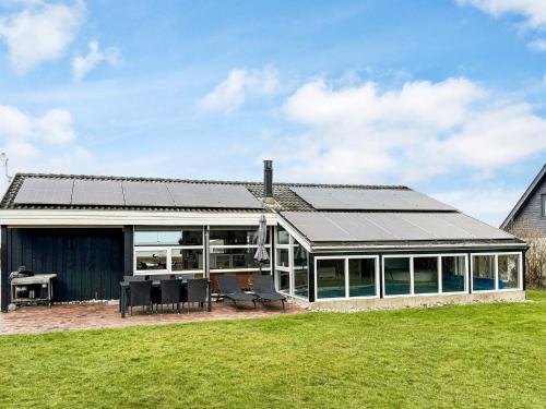 a conservatory with a solar roof on a house at 10 person holiday home in Allingåbro-By Traum in Nørager