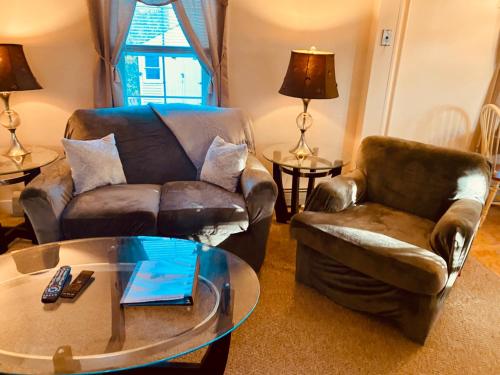 a living room with a couch and a coffee table at Private Entrance Residential Portland in Portland