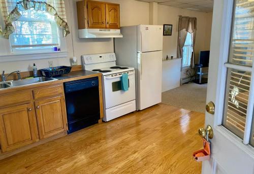 a kitchen with a stove and a sink and a refrigerator at Private Entrance Residential Portland in Portland