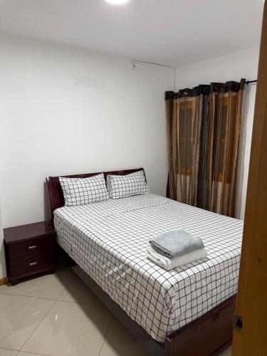 a bedroom with a bed with a pillow on it at Casa Cucuia in Praia