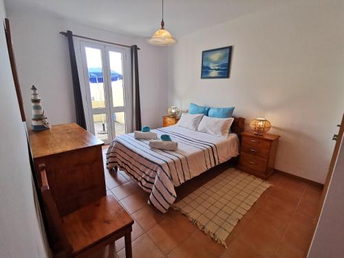 Postel nebo postele na pokoji v ubytování Sea & Sand Guest House