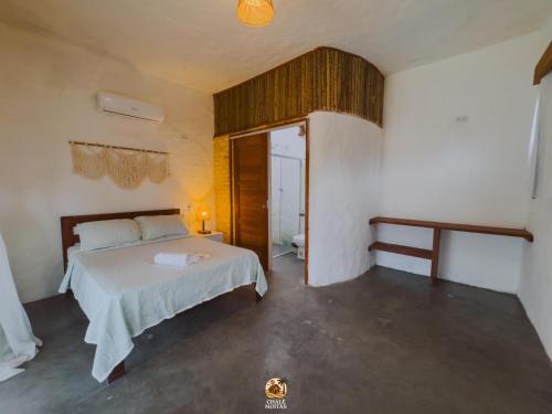 Postel nebo postele na pokoji v ubytování Moitas Chalés