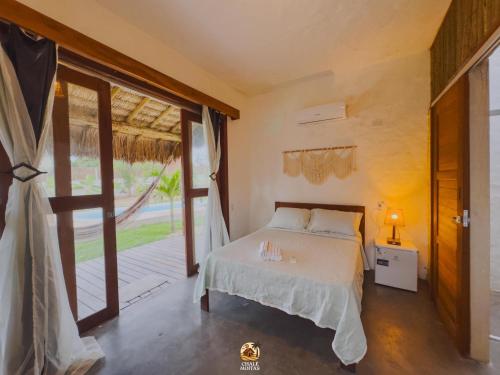 Ein Bett oder Betten in einem Zimmer der Unterkunft Moitas Chalés