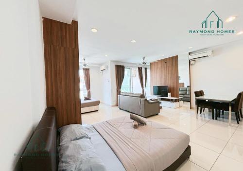a bedroom with a bed and a living room at Gurney Drive Mansion One Serviced Apartment in George Town