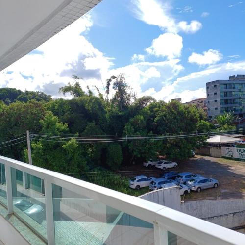 a balcony with cars parked in a parking lot at Enjoy the beaches and the historic part of Ilheus - Desfrute das praias e da parte histórica de Ilheus in Ilhéus