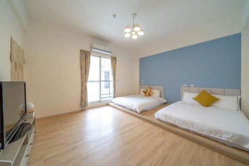 Cama o camas de una habitación en Senhuojia Homestay