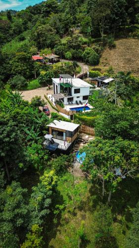 an aerial view of a house with a boat at Finca Boutique Los Laureles Villeta in Villeta