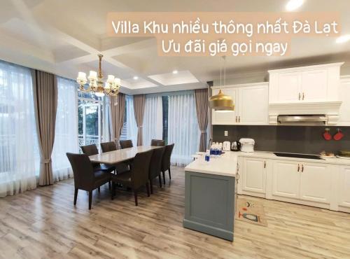 a kitchen and dining room with a table and chairs at Chillin Villa - Biệt Thự Đà Lạt Khu Nhiều Thông Gần Hồ Tuyền Lâm in Xuan An